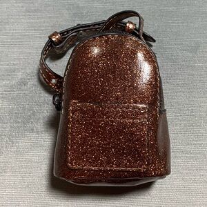 NWT luxury mini backpack functional,charm or wrist pack 3”x3.75”x2”glitter brown